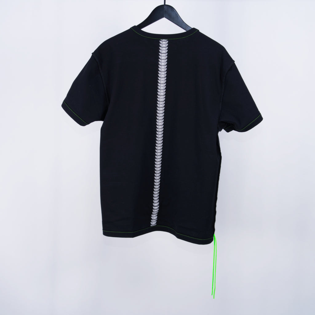 Black t-shirt with a vertical design of stacked smiling grins that run down the middle center of the shirt with two neon green cords hanging off the bottom corner on a white background.