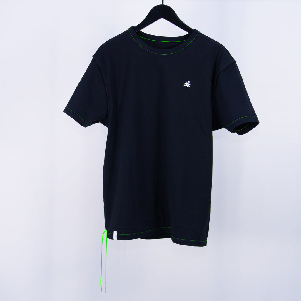 Black t-shirt with neon green contrast stitching, a small white logo on a hanger, and two neon green cords hanging off the bottom corner against a white background