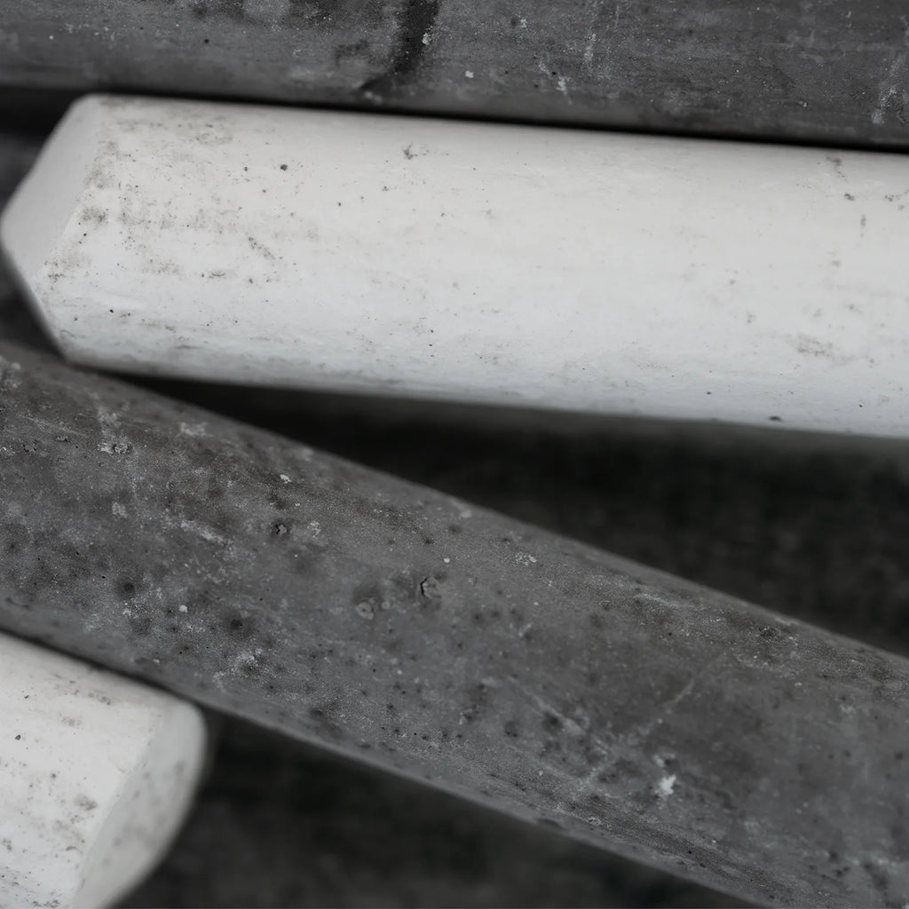pieces of black and white chalk from the normal;c movement chalk kit