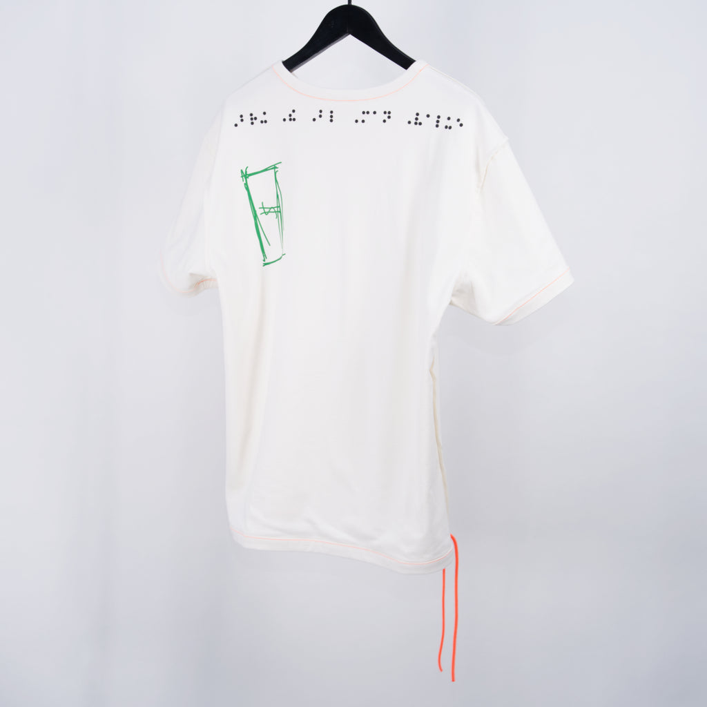 normal;c movement Blind Value Internal Hanging Thread T-Shirt in white with green and black graphics, on a white background, hanging on black hanger.