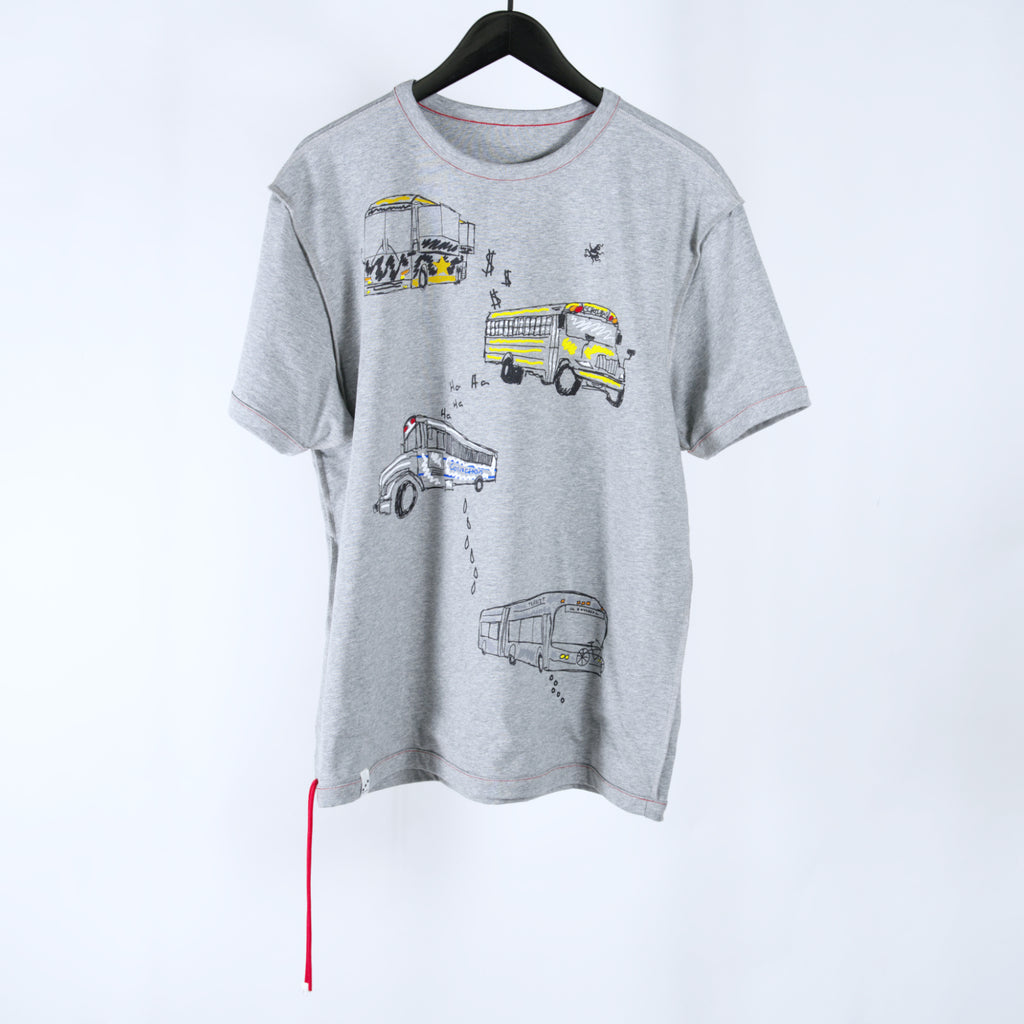 Gray t-shirt with bus designs and two cords hanging off the bottom corner on a clothing hanger against a white background