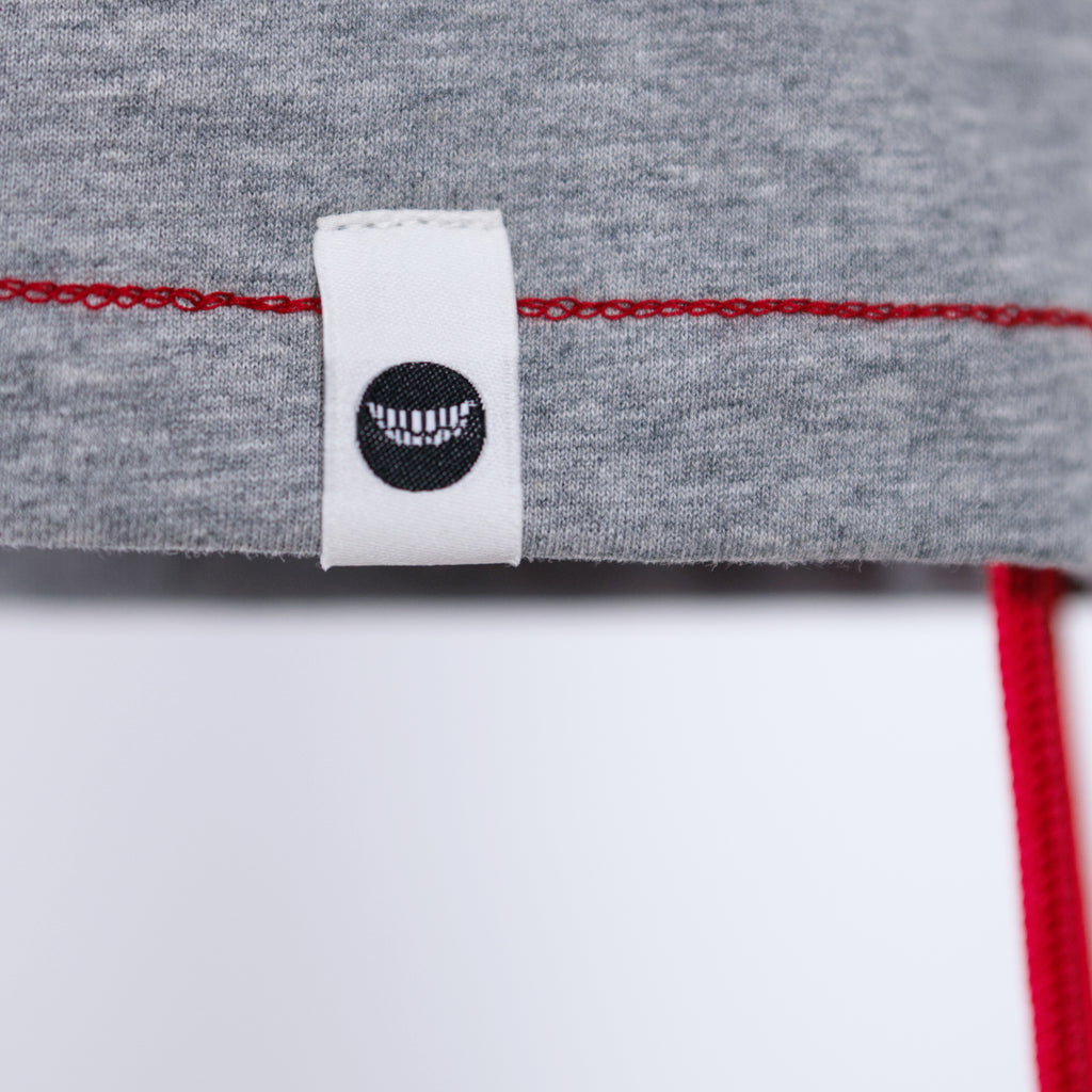 Gray fabric with a white label featuring a black logo on a white background